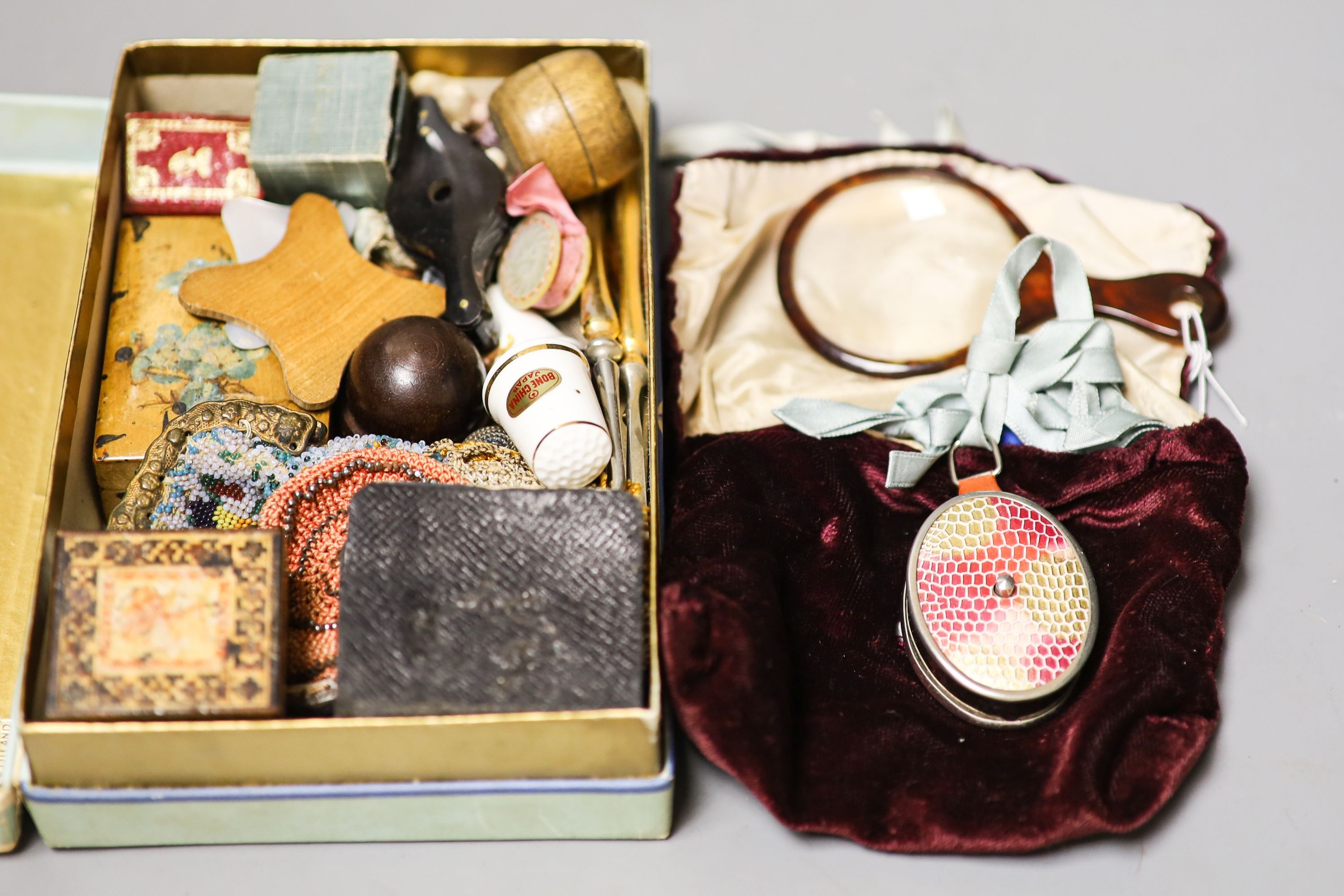 A collection of cabinet curiosities including beadwork purses, thimbles, Tunbridgeware stamp case, miniature album etc.